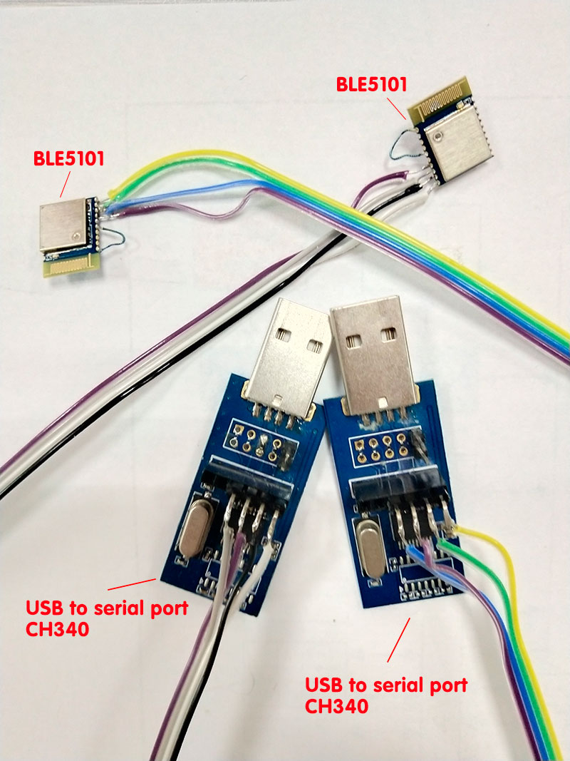 2pcs of BLE5101 modules with wires connected to the serial port Pin and power Pin, and then connected with the USB port of the computer